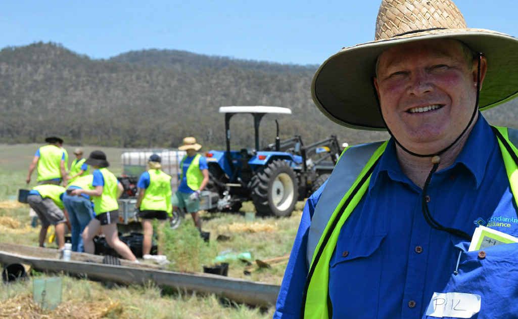 WORKING HARD: Condamine Alliance CEO Phil McCullough with his helpers from Deloitte in Brisbane.